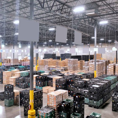 warehouse with crates and boxes organized on floor.