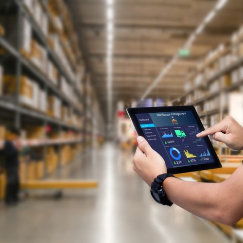 Smart,Warehouse,Management,System.worker,Hands,Holding,Tablet,On,Blurred,Warehouse
